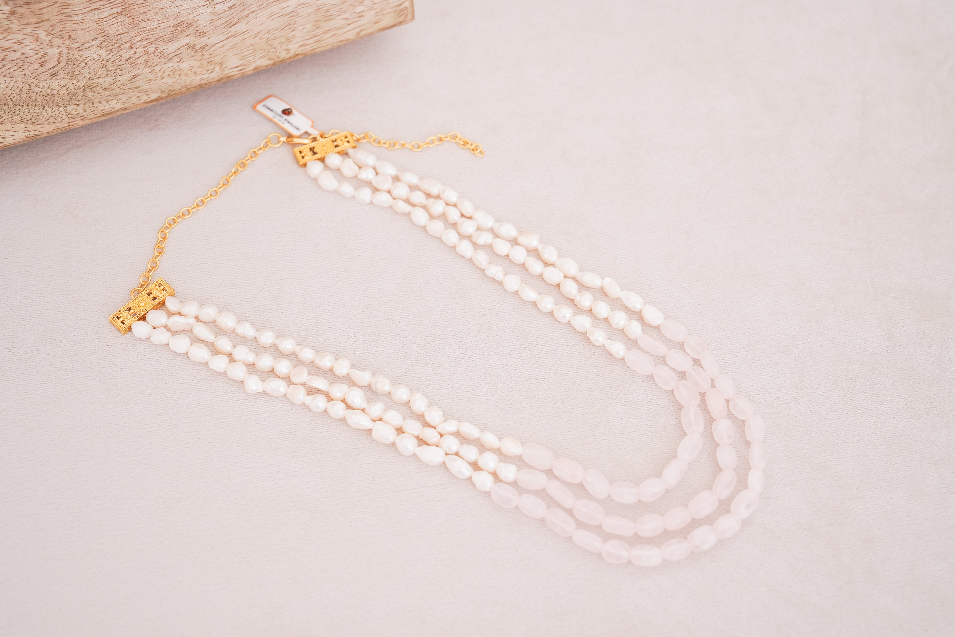 Elegant Multi-Strand Pearl with Rose quartz centre Necklace